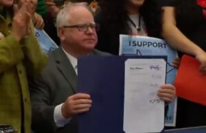 Flashback: VP Pick Tim Walz Smiles for Cameras as He Signs Bill That Gives Illegal Immigrants Drivers Licenses | The Gateway Pundit