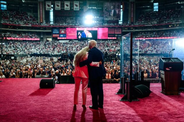 Erika-Kirk-and-President-Trump-from-behind.jpg